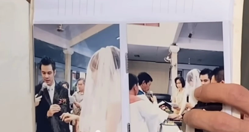 Roby Tremonti perlihatkan foto pernikahannya dengan Aurelie Moeremans kepada wartawan [YouTube]